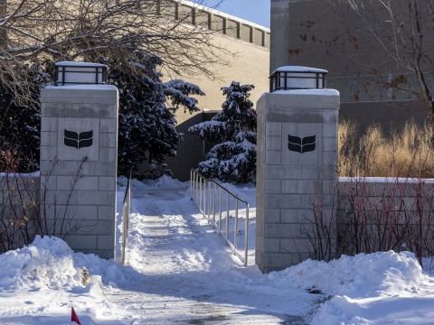 Grinnell College gates surrounded by a snowy landscape