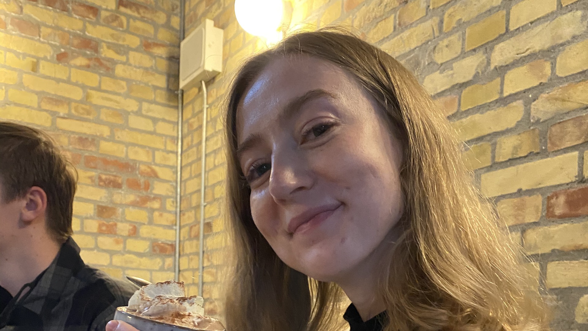 Claire holding coffee