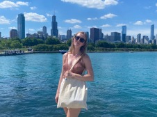 Girl taking photo in front of water front 
