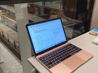 Student computer on edge of desk