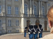 Photo of marching soldiers in front of building