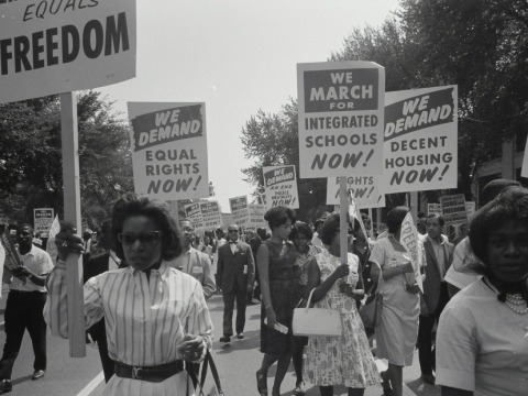 Women and men marching for equal rights