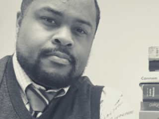 Image of Darrius D. Hills, a religious studies associate professor at Grinnell College